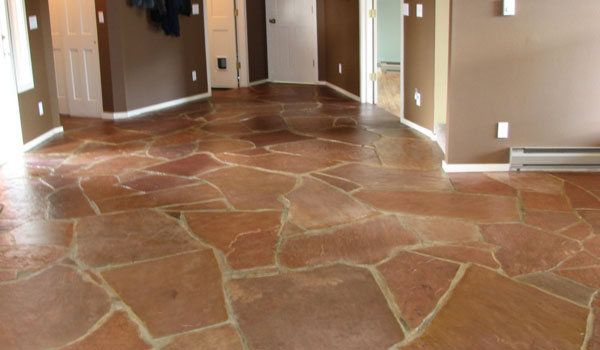 Red, stone tile floor freshly cleaned